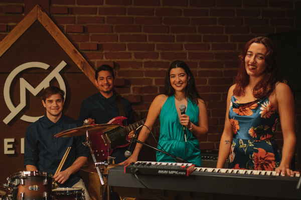 Professional picture of our Argentina live band for events standing at instruments prior to performance | Altus Entertainment
